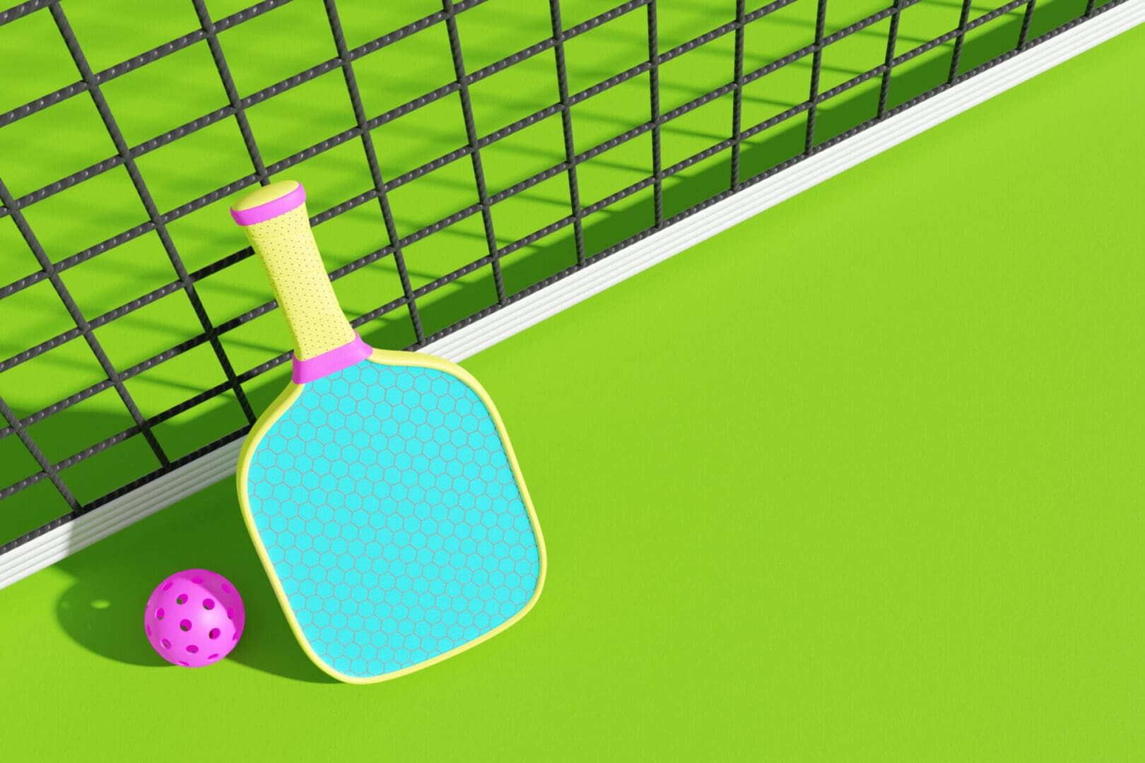 Pickleball paddle and ball on court.